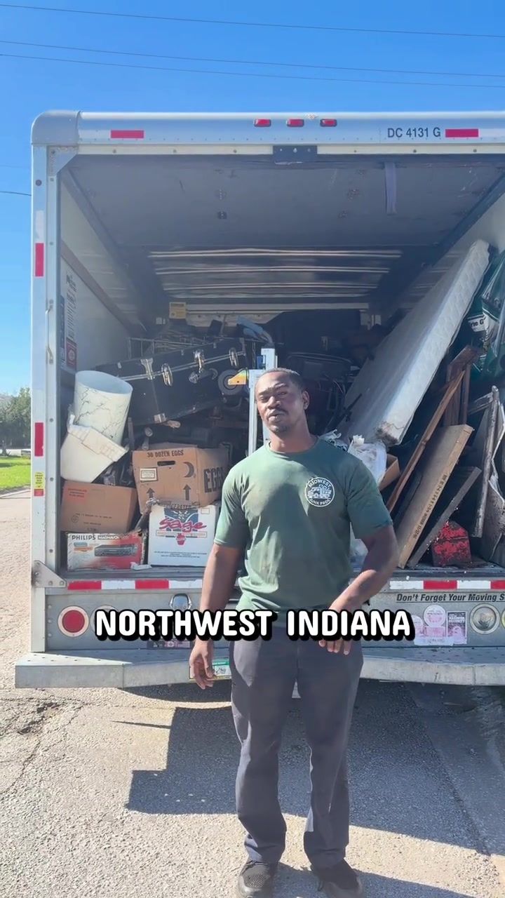 Midwest Junk Pros owner beside a loaded removal truck — Meet your local crew