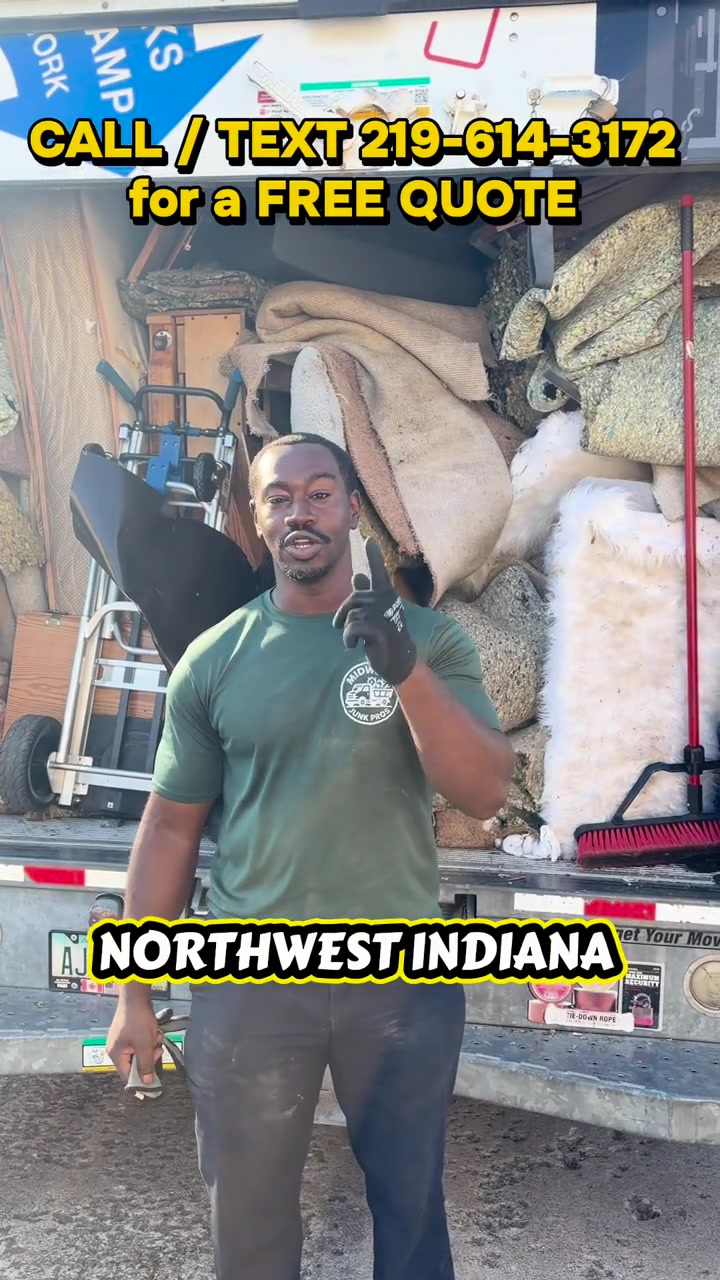 Midwest Junk Pros owner beside a loaded removal truck — Cleanout crew