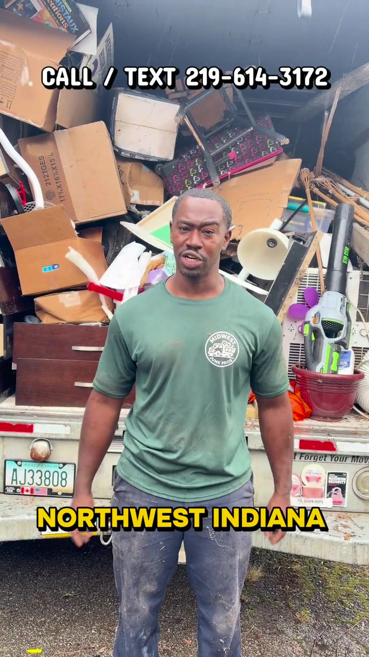 Midwest Junk Pros owner beside a loaded removal truck — Northwest Indiana